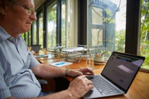 Man on a laptop computer taking an online course on Abbatraining.com