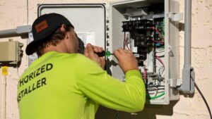 An Electrician in Texas working on an electrical panel