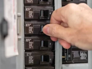 Electrician in Texas working on an electrical panel